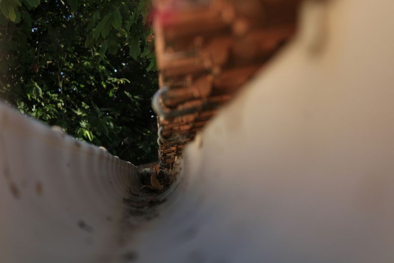 Close-up view down the length of a gutter channel