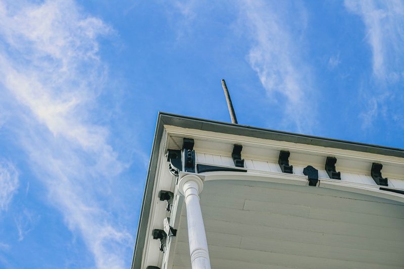 Roof edge and trim profile against a blue sky